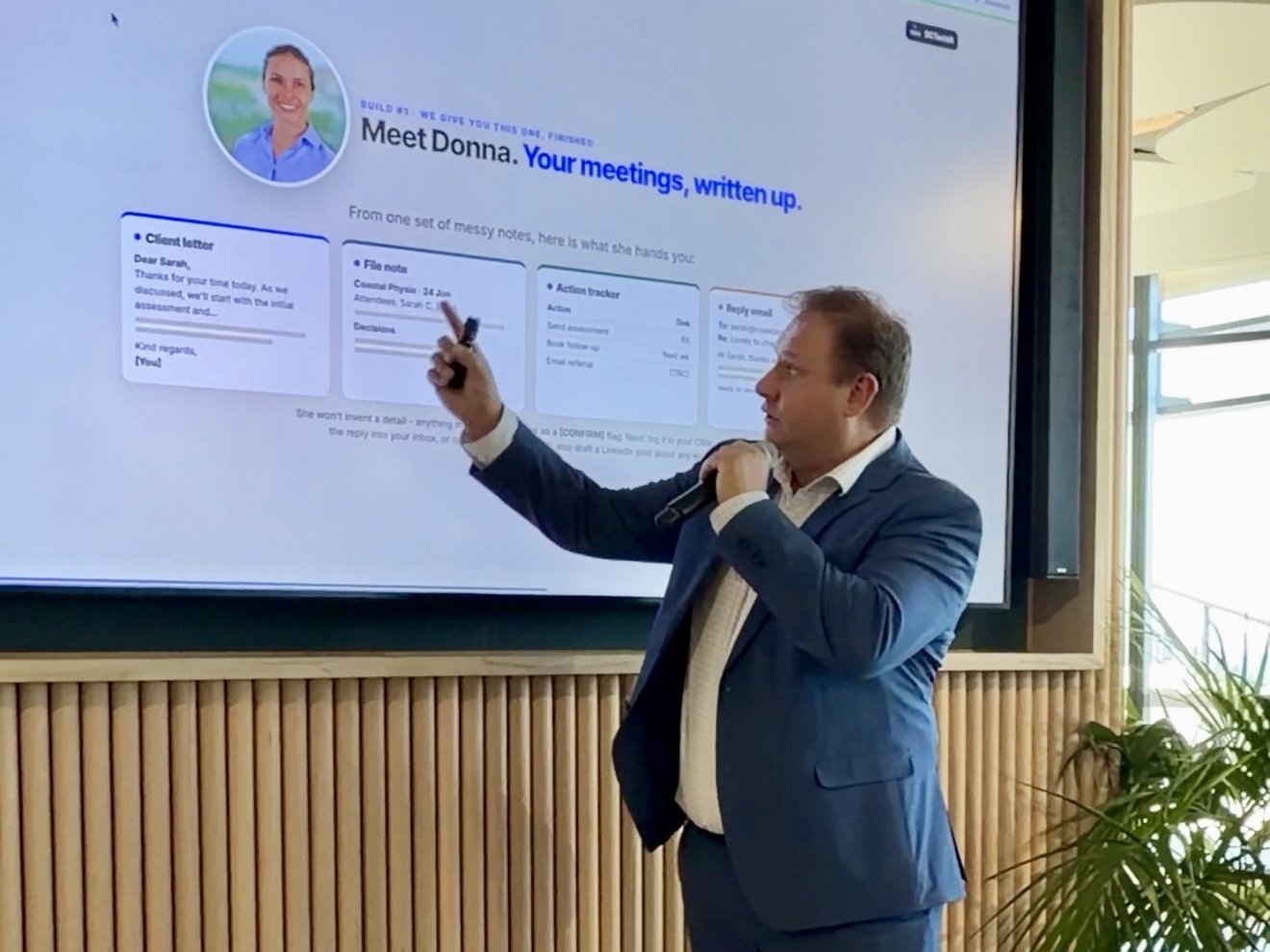 Bart Puszko presenting Donna, the AI consultation assistant, on screen at an AI workshop